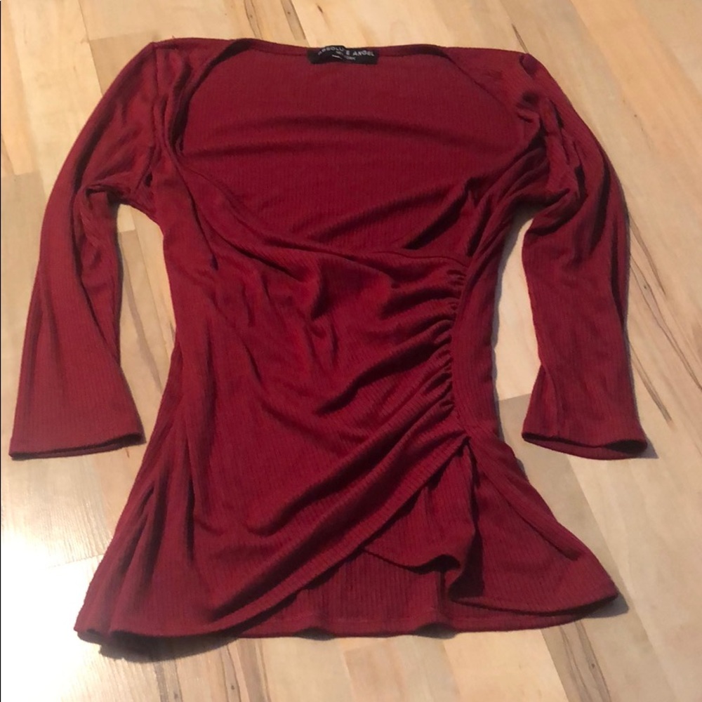 Red low cut-medium sleeve shirt.